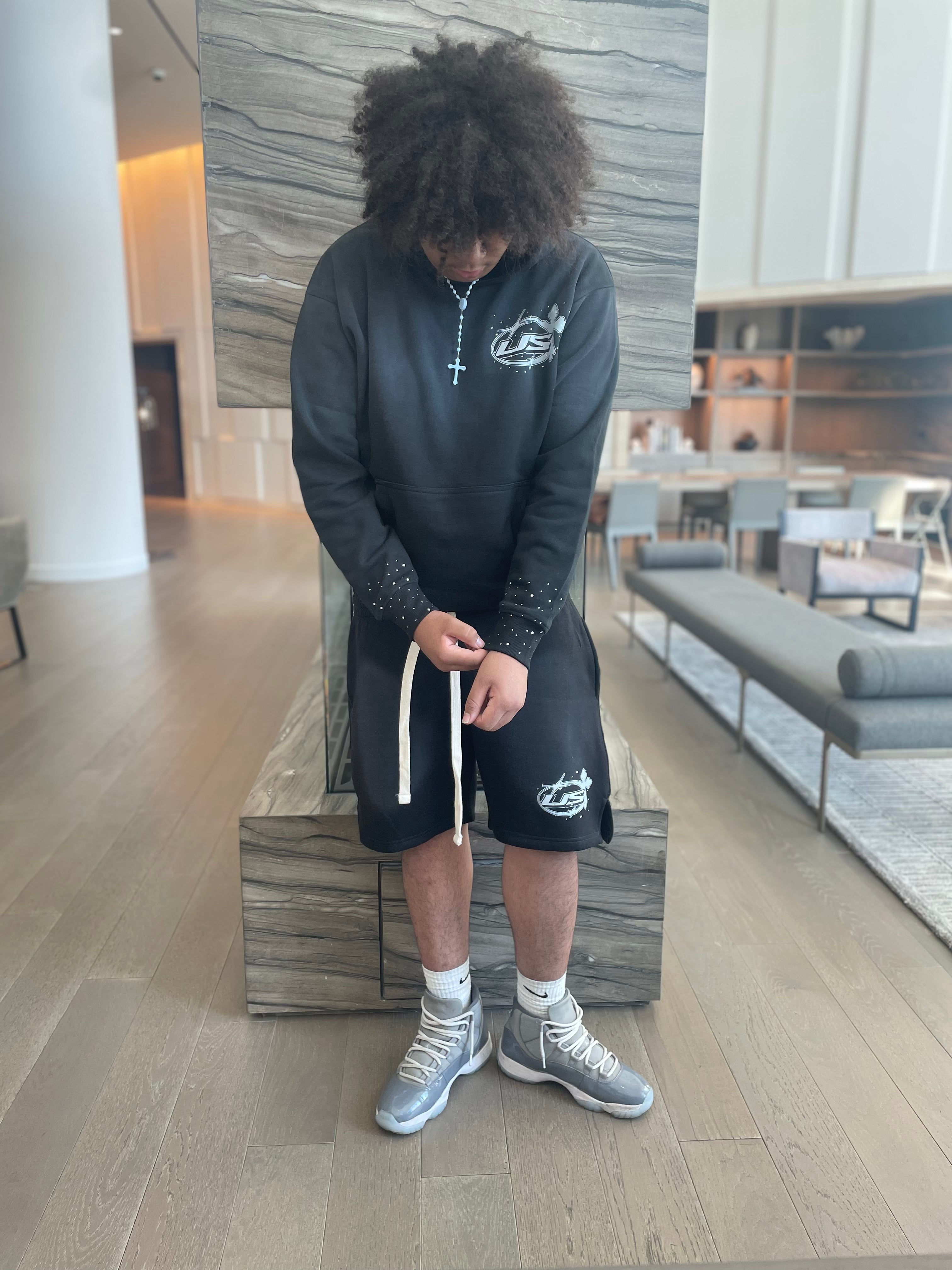 BLACK "THE STORY" PULL OVER HOODIE AND SHORT SET.